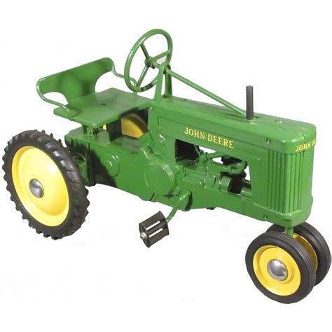 The side reads Made by Ertl CO. . John deere pedal tractor